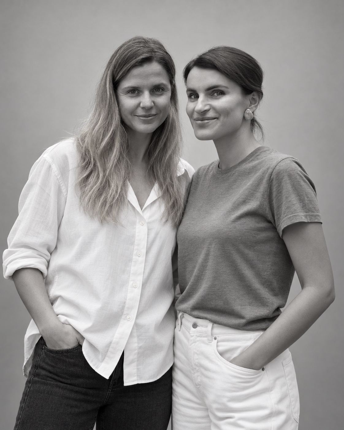 Bea and Lisa together in a black-and-white studio portrait, edited from their original photograph.